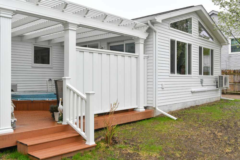 Pergola covered deck area connected to home addition built in Lansing Michigan