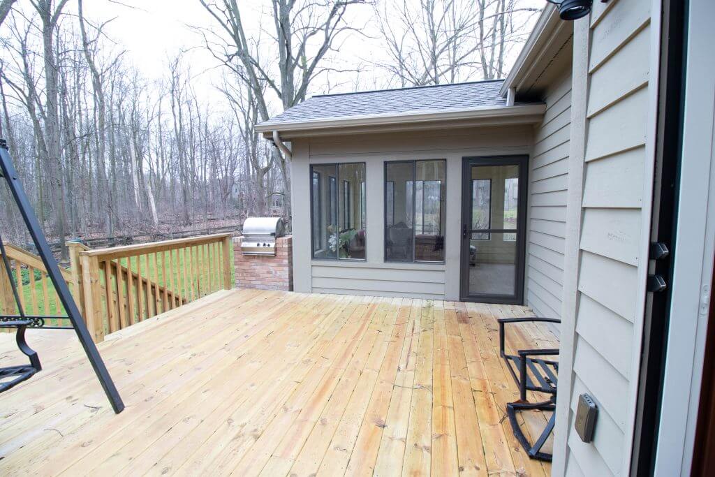 backyard deck addition connected to remodeled kitchen by Odd Fellows Contracting in Okemos, MI