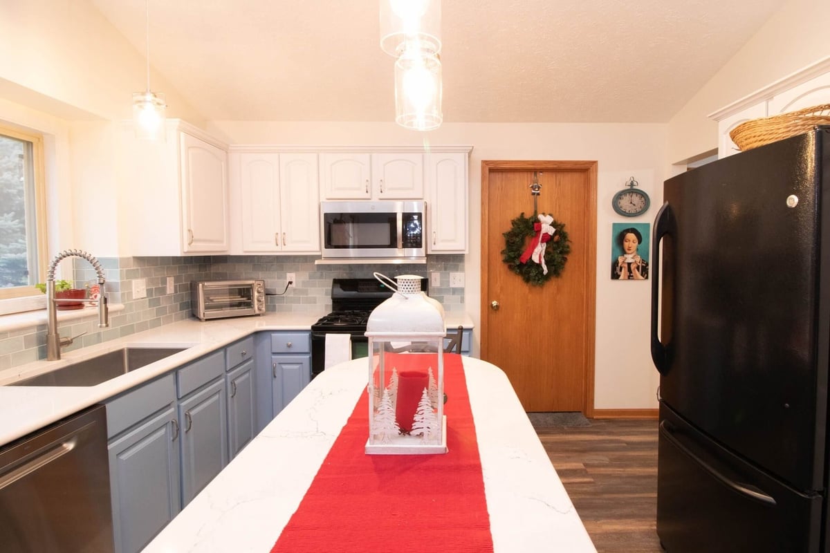modern kitchen remodel with center island and open layout by Odd Fellows Contracting in Charlotte, MI