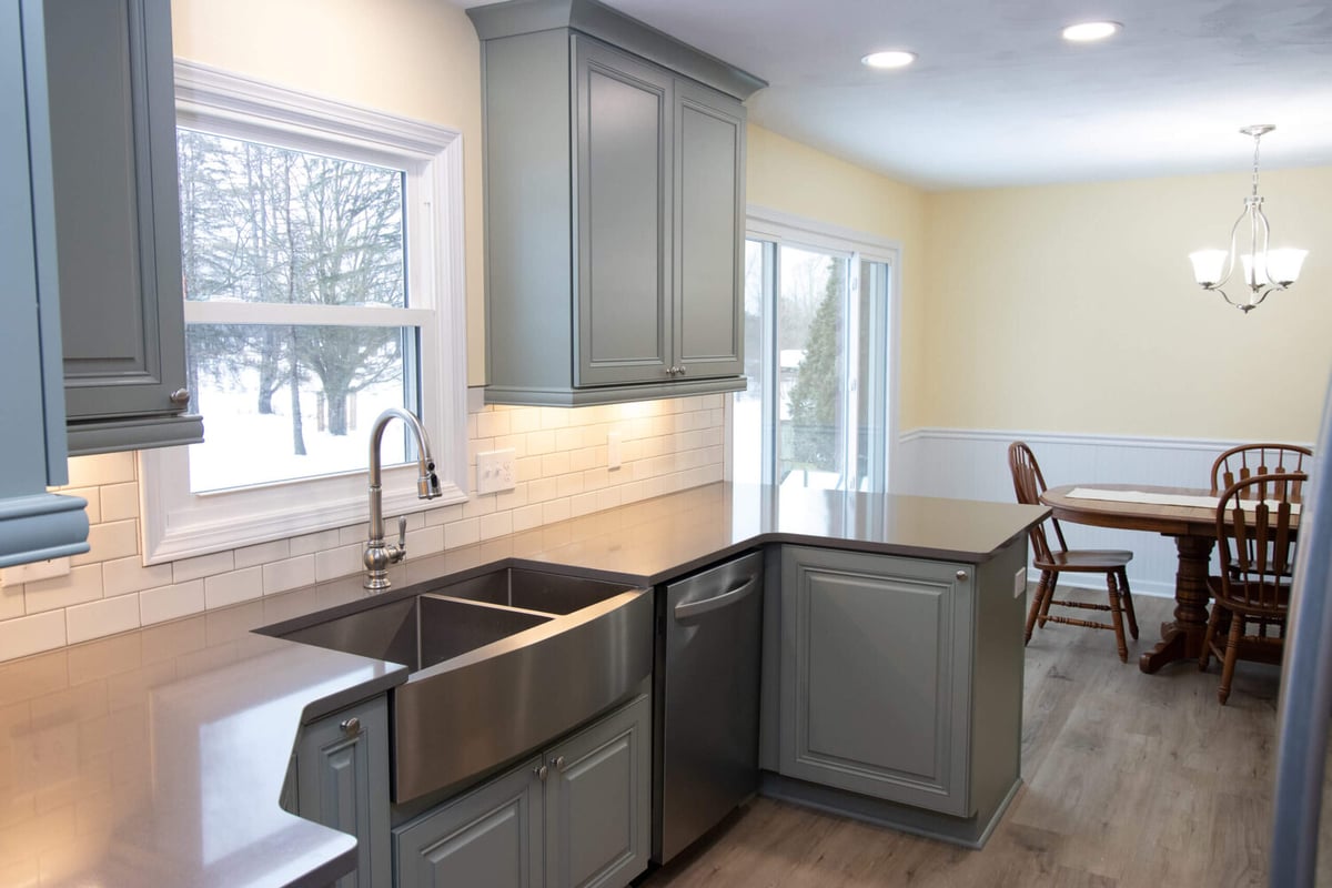 kitchen remodel featuring apron front sink and modern cabinetry layout by Odd Fellows Contracting in Williamston, MI