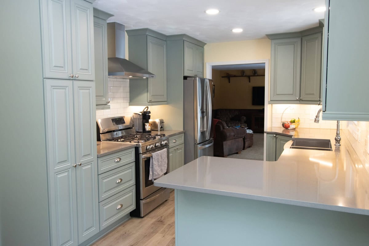 modern kitchen remodel with custom cabinetry and quartz countertops by Odd Fellows Contracting in Williamston, MI