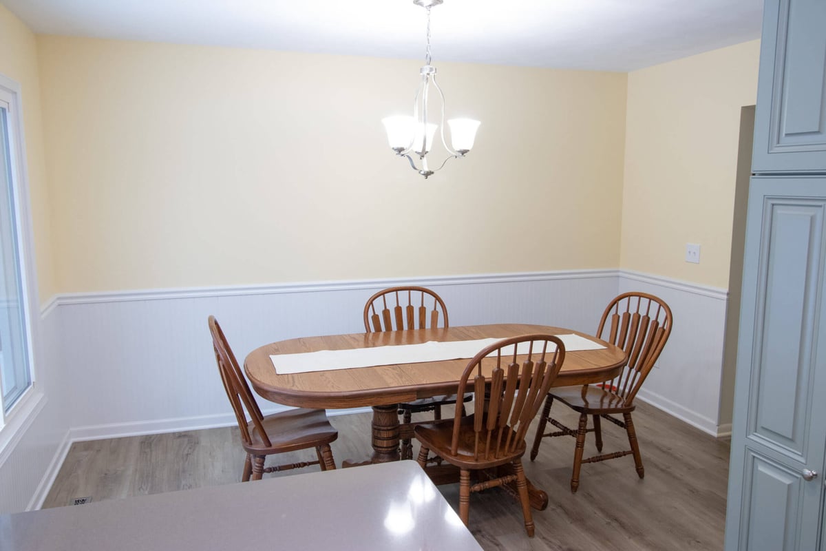 modern kitchen renovation with island seating and custom cabinetry by Odd Fellows Contracting in Williamston, MI