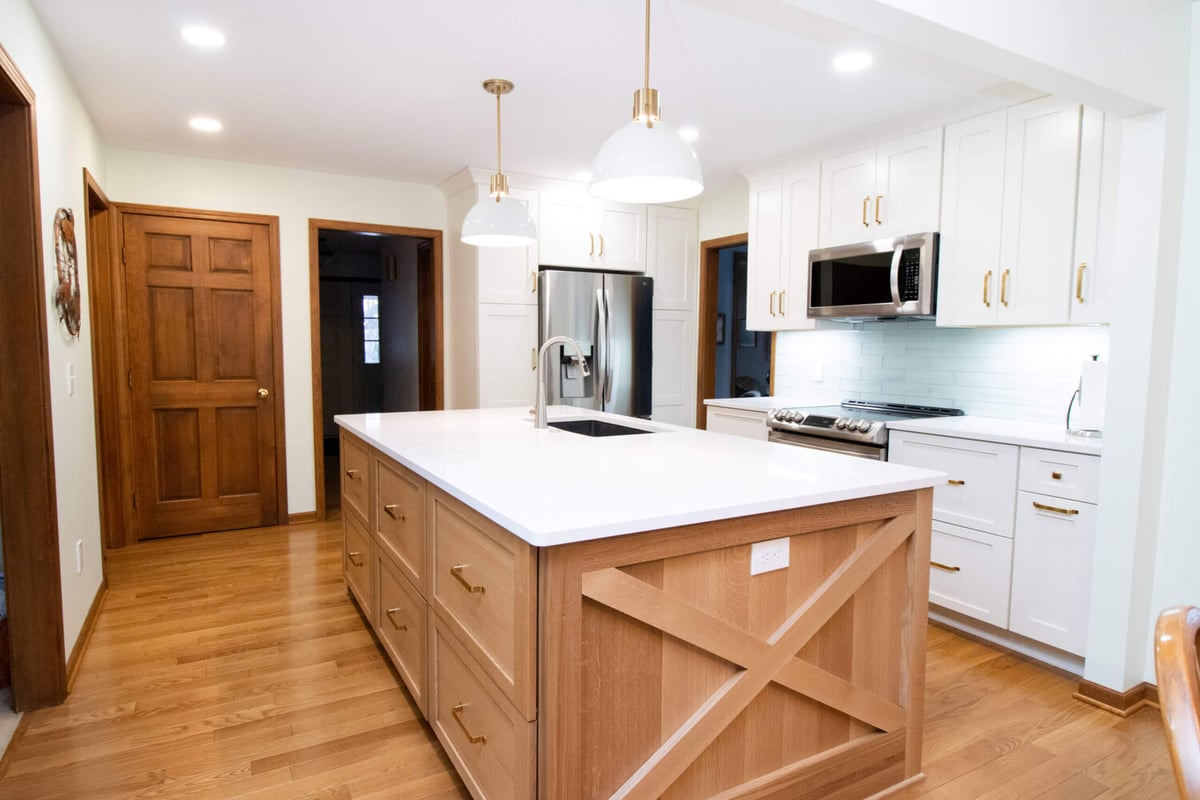 kitchen renovation featuring modern island design and custom cabinets by Odd Fellows Contracting in Okemos, MI