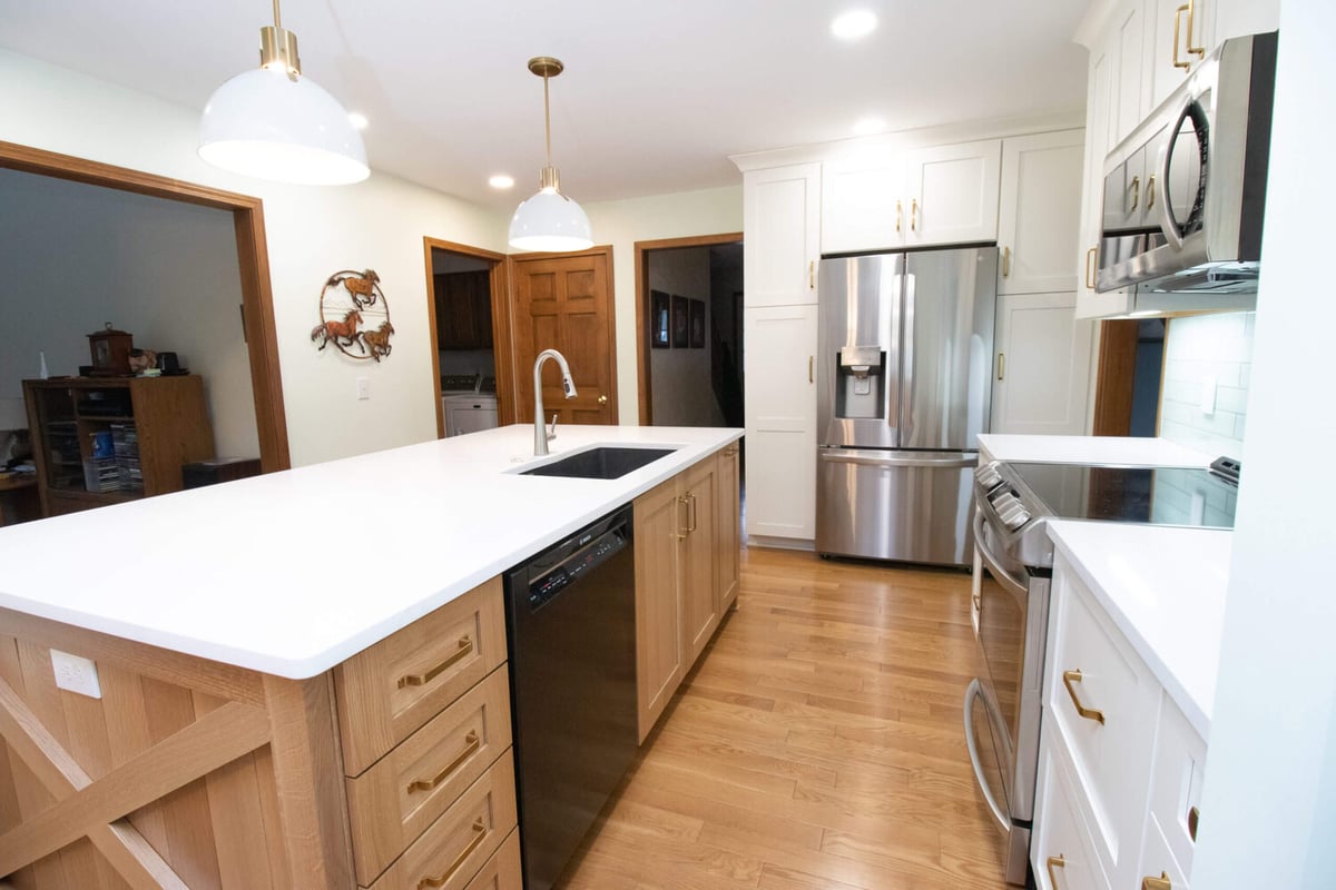 modern kitchen renovation with stainless steel appliances and custom cabinetry by Odd Fellows Contracting in Okemos, MI