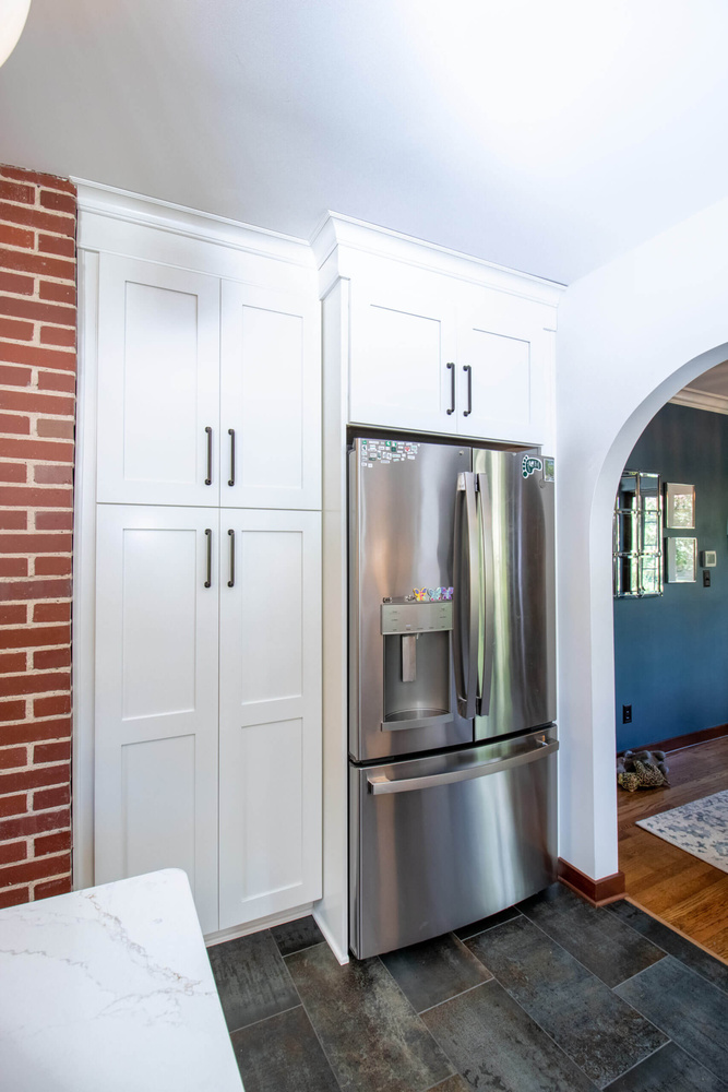 remodeled kitchen with refrigerator wall and custom cabinets by Odd Fellows Contracting in East Lansing MI
