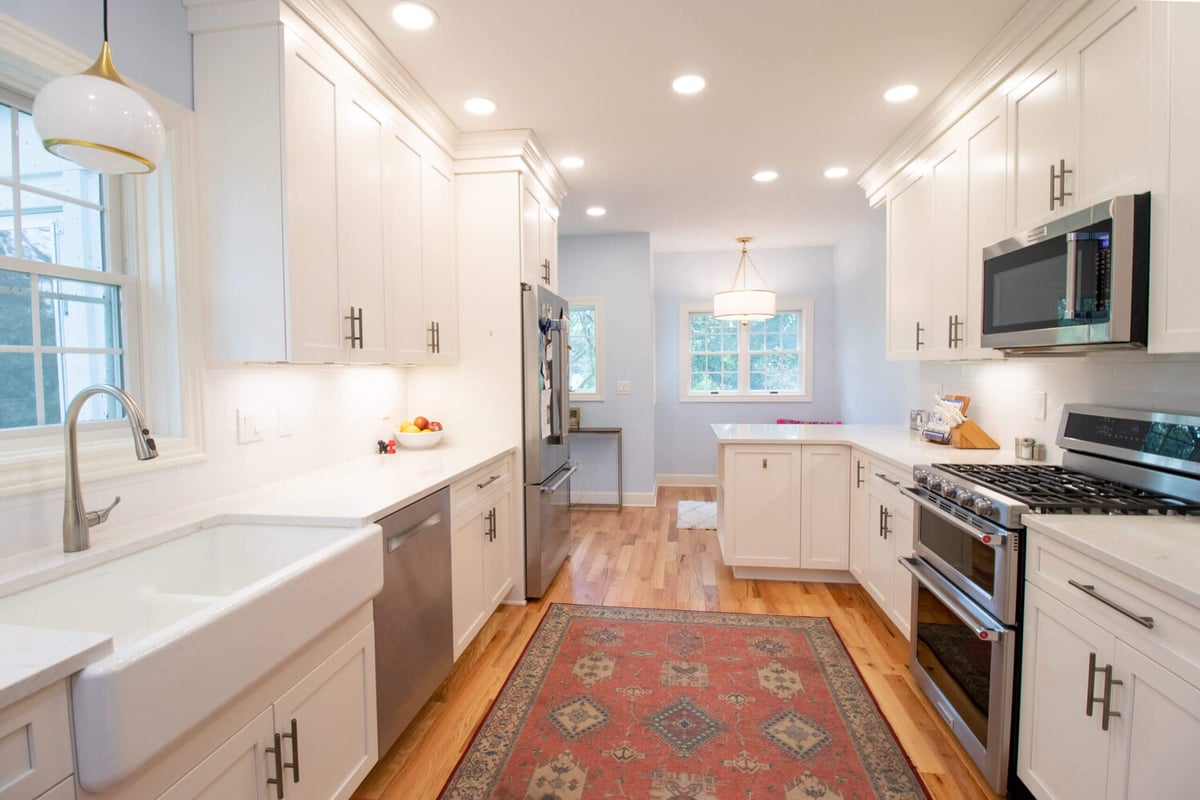 remodeled kitchen by Odd Fellows Contracting in Mason MI with island seating and upgraded finishes