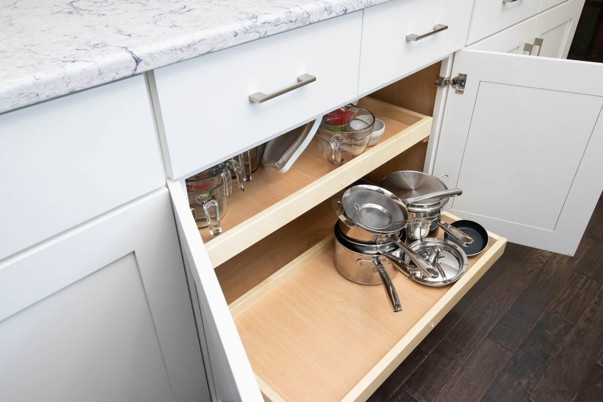 kitchen storage solution by Odd Fellows Contracting in Haslett MI with pull-out drawers and organized cabinetry