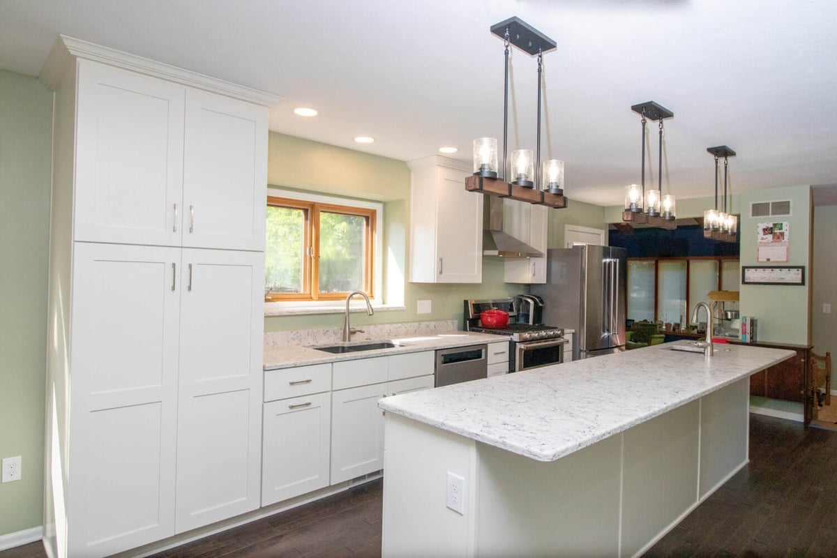updated kitchen by Odd Fellows Contracting in Haslett MI with large island and stainless steel appliances