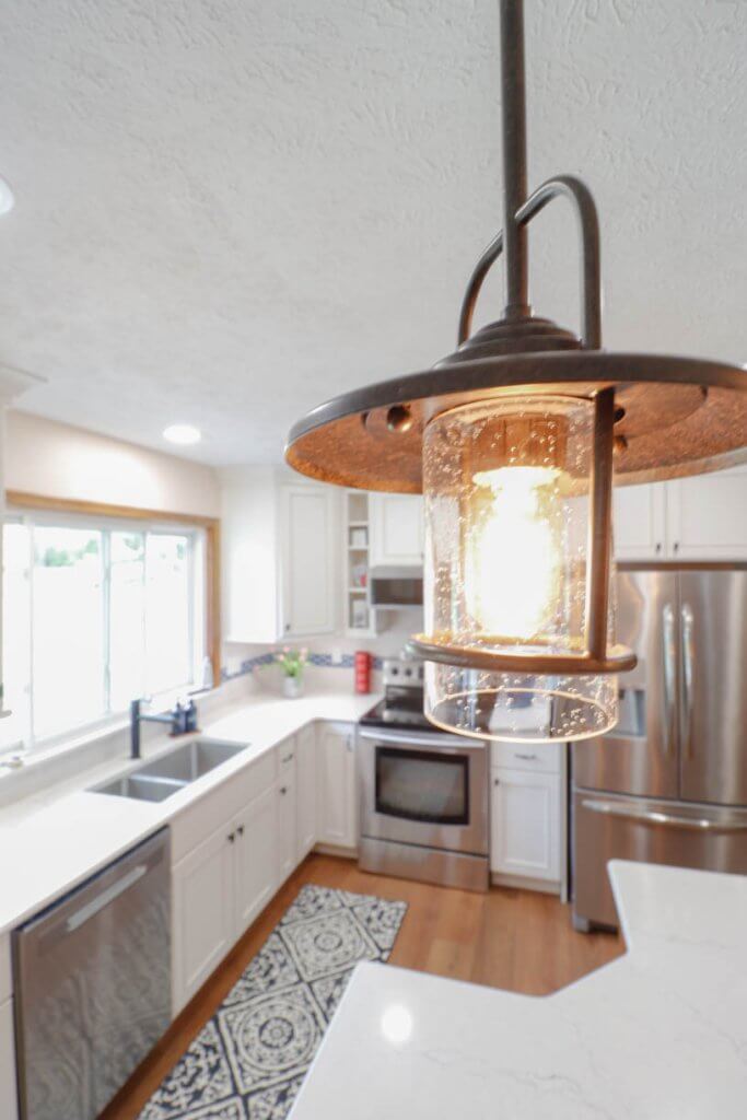 Close-up of pendant lighting in a Williamston, MI kitchen remodel by Odd Fellows Contracting.