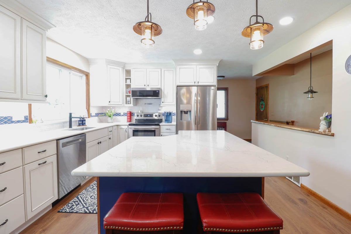 Kitchen island detail in a Williamston, MI remodel by Odd Fellows Contracting featuring quartz countertop and seating.