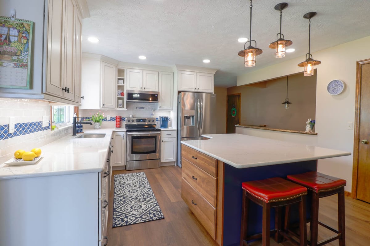Williamston, MI kitchen renovation by Odd Fellows Contracting featuring updated backsplash and countertops.
