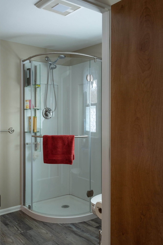 modern walk-in shower with glass enclosure from remodel by Odd Fellows Contracting in Eaton Rapids, MI