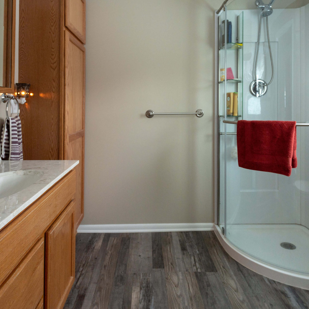 remodeled bathroom with glass corner shower and vanity by Odd Fellows Contracting in Eaton Rapids, MI