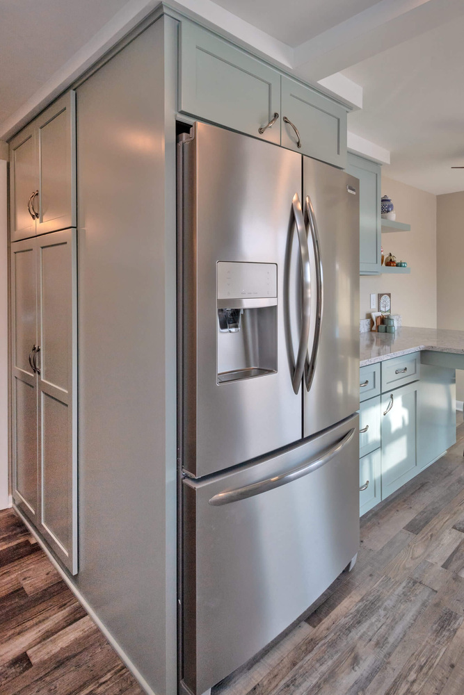 stainless steel refrigerator installed in kitchen remodel by Odd Fellows Contracting in Eaton Rapids, MI
