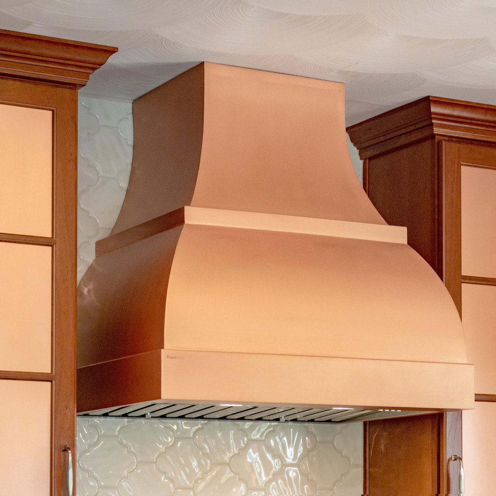 close up of copper kitchen range hood from remodel by Odd Fellows Contracting in Grand Ledge, MI
