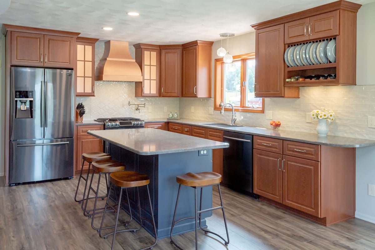 modern kitchen remodel with large island seating by Odd Fellows Contracting in Grand Ledge, MI