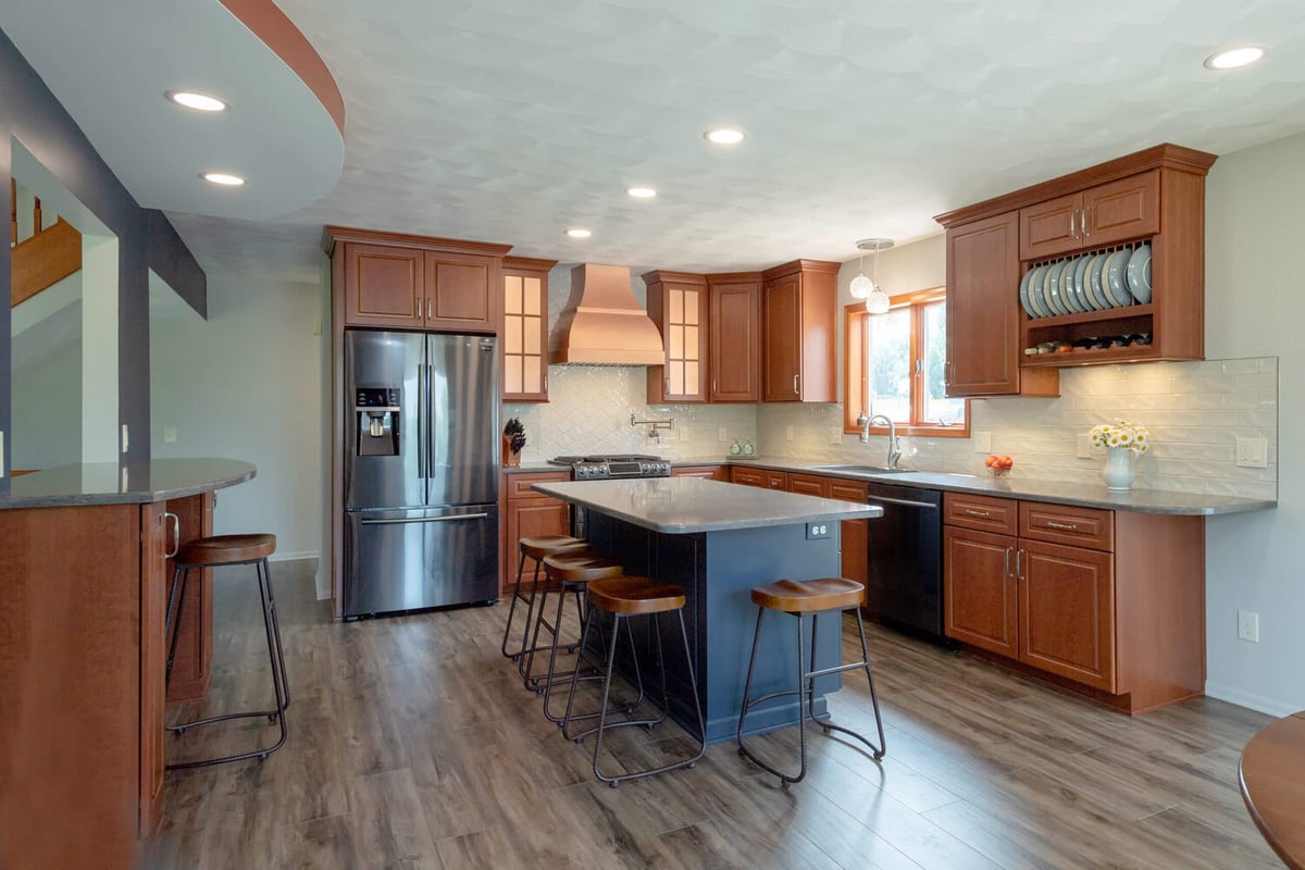 open concept kitchen remodel with island and custom cabinetry by Odd Fellows Contracting in Grand Ledge, MI