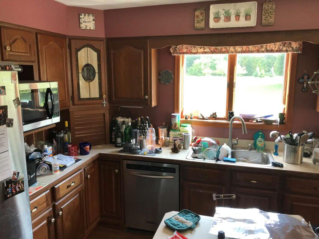 outdated kitchen before remodel with wood cabinets by Odd Fellows Contracting in Grand Ledge, MI