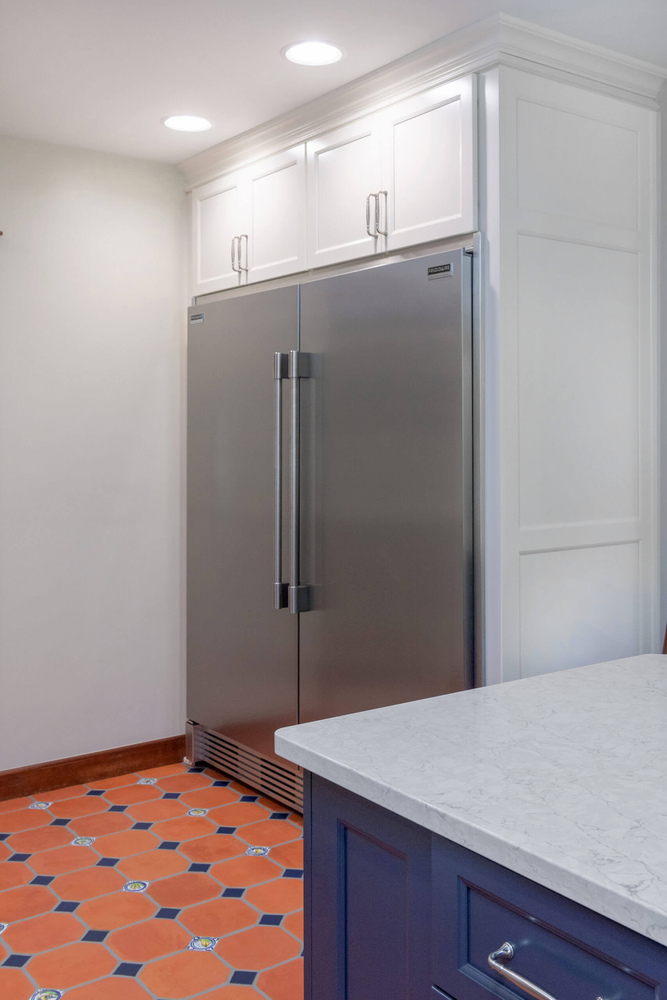 built in refrigerator with custom cabinetry in kitchen remodel by Odd Fellows Contracting in Okemos, MI