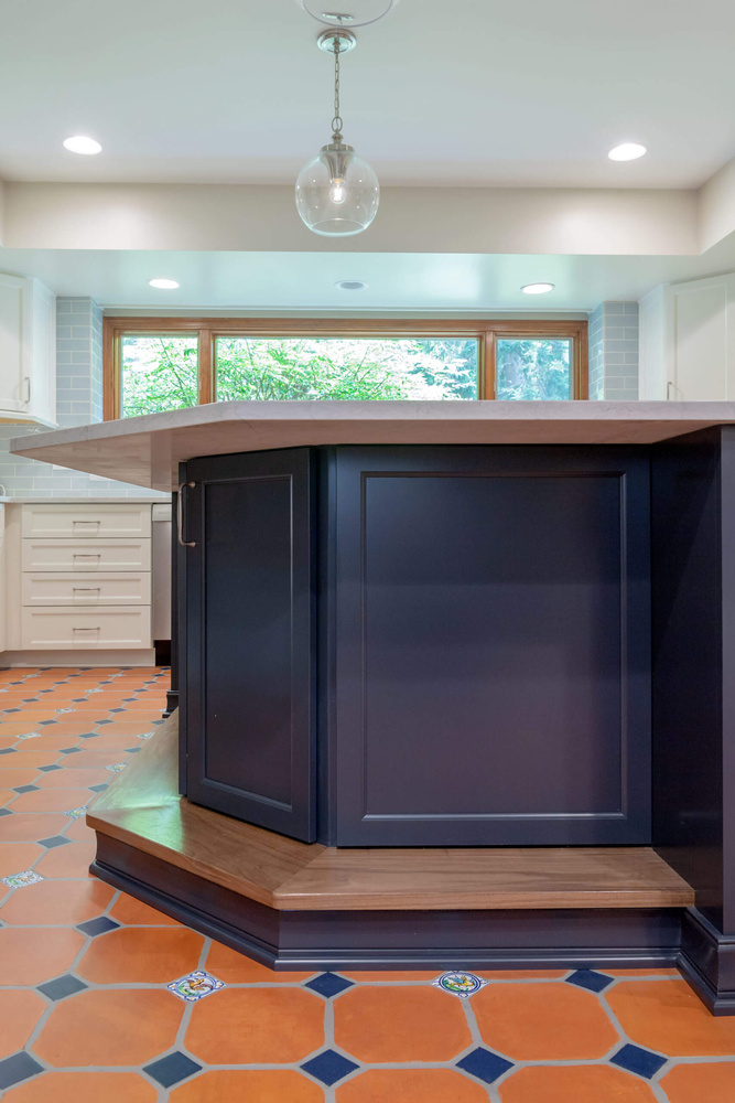 custom navy kitchen island with quartz countertop by Odd Fellows Contracting in Okemos, MI