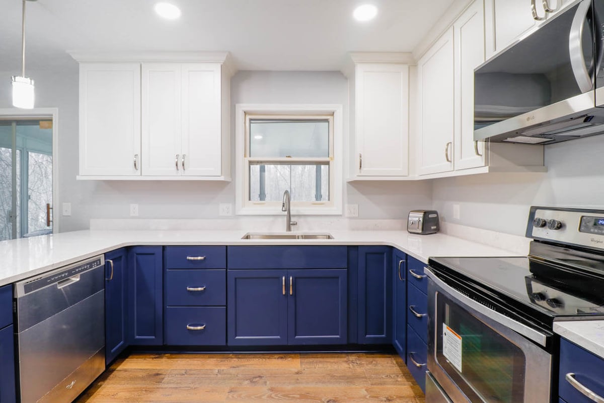 Modern kitchen update in West Lansing, MI by Odd Fellows Contracting with bright finishes and improved layout.