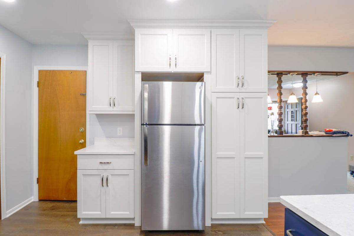 West Lansing, MI kitchen renovation by Odd Fellows Contracting showcasing custom white cabinets.
