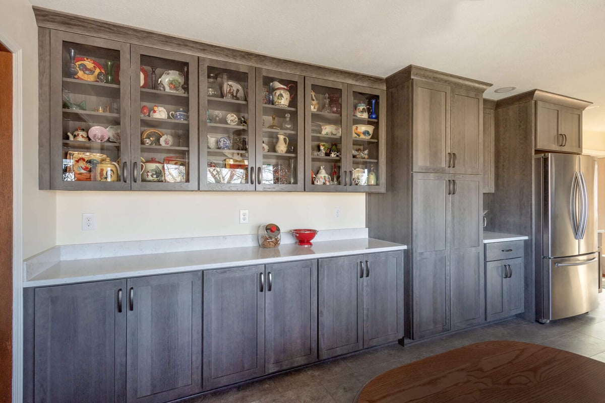 kitchen remodel with built in display cabinets and quartz countertop by Odd Fellows Contracting in Onondaga, MI
