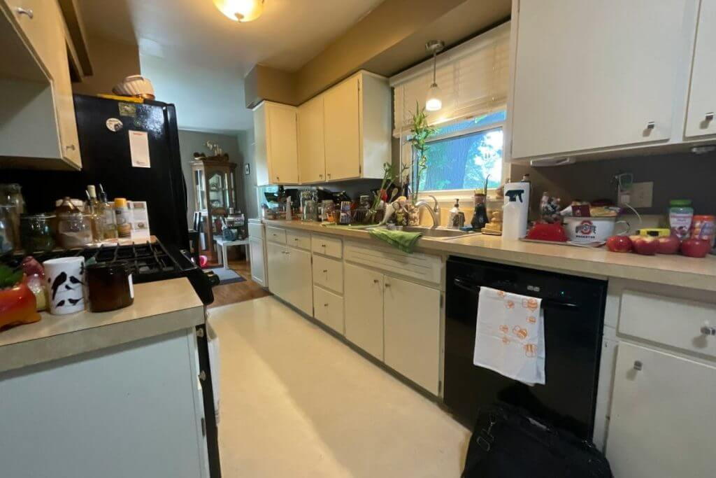 before kitchen remodel by Odd Fellows Contracting in Cumberland Lansing, MI with dated cabinets and laminate countertops