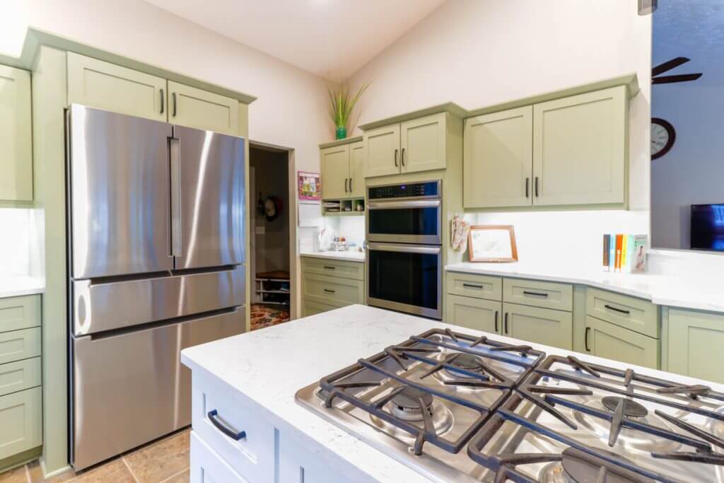 updated kitchen corner layout by Odd Fellows Contracting in Candlewood Estates, MI with quartz counters