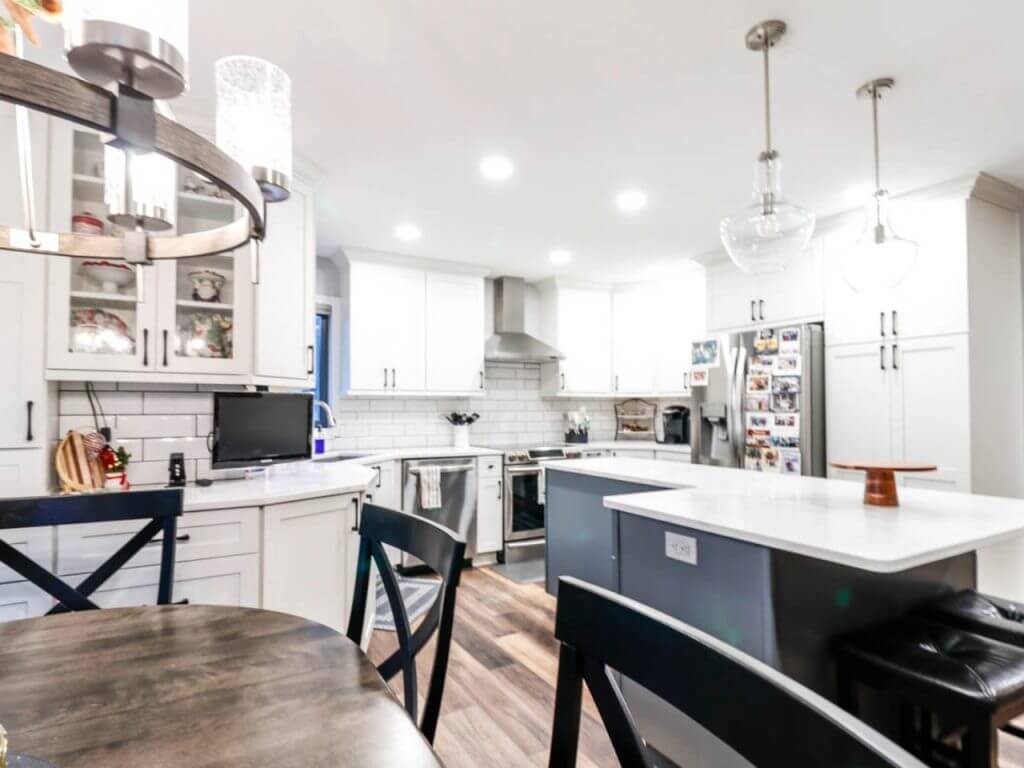 updated kitchen design by Odd Fellows Contracting in Walmar Estates, MI with open layout and pendant lighting