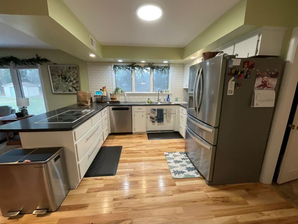 original kitchen layout before remodel by Odd Fellows Contracting in Hiawatha Lakes, Okemos, MI with dated cabinetry and countertops