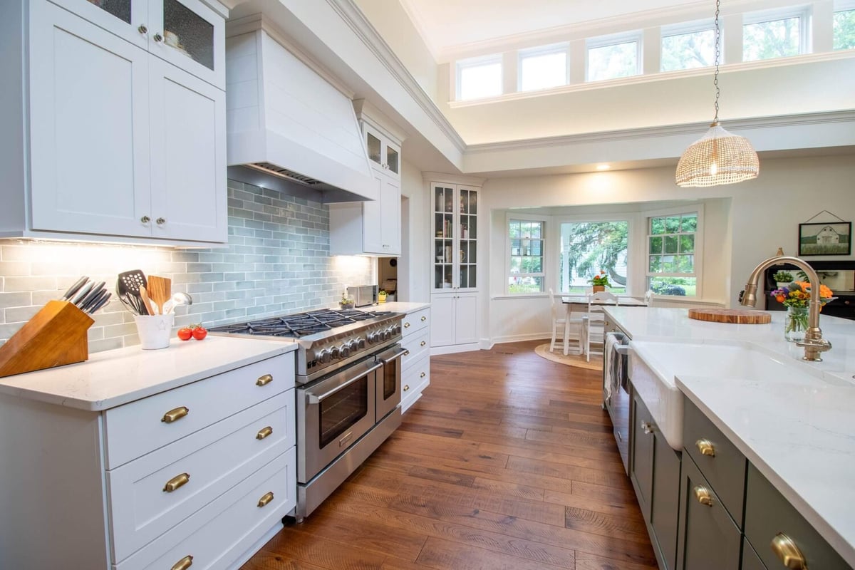 Okemos, MI kitchen renovation featuring pendant lighting and custom cabinets by Odd Fellows Contracting