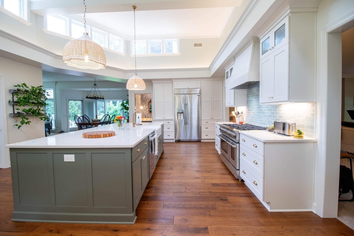 bright open kitchen remodel by Odd Fellows Contracting in Okemos, MI featuring expansive island