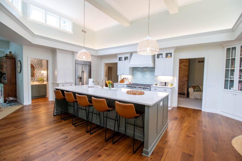 finished Okemos, MI kitchen renovation featuring oversized island and pendant lighting by Odd Fellows Contracting