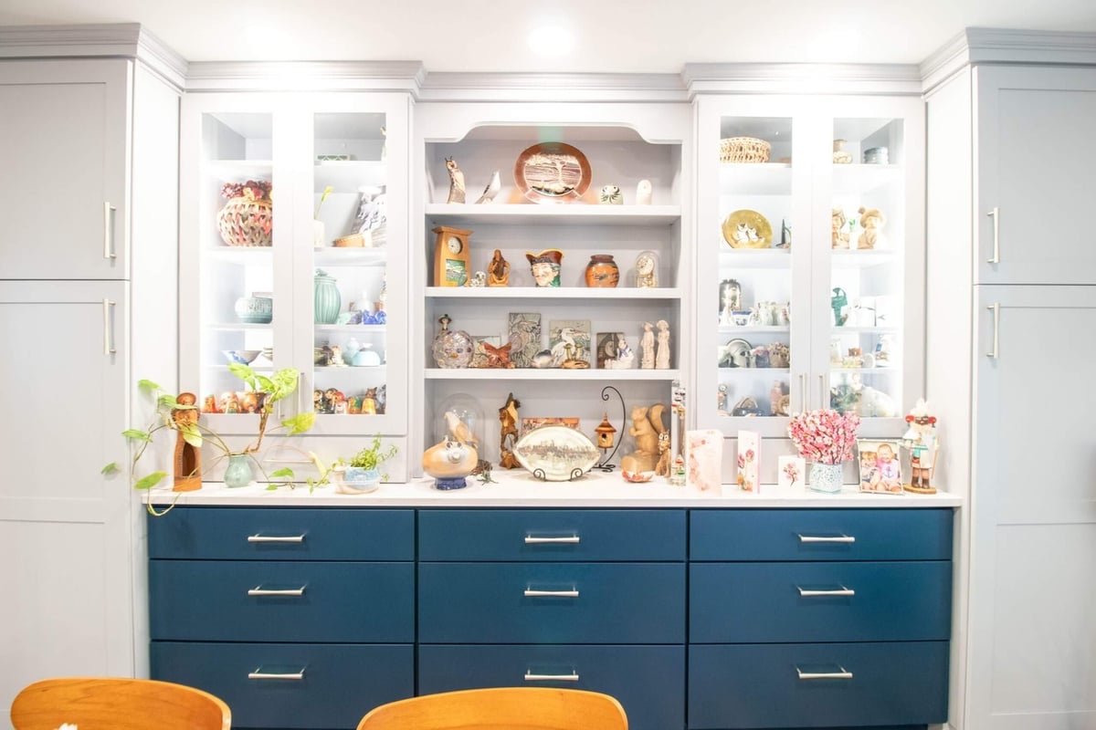 built-in dining room cabinetry with blue drawers in Okemos, MI custom home by Odd Fellows Contracting