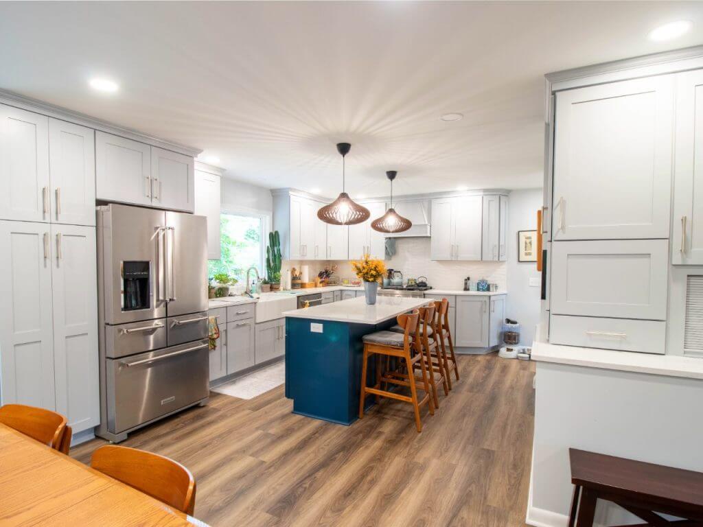completed kitchen remodel in Okemos, MI custom home by Odd Fellows Contracting featuring blue island