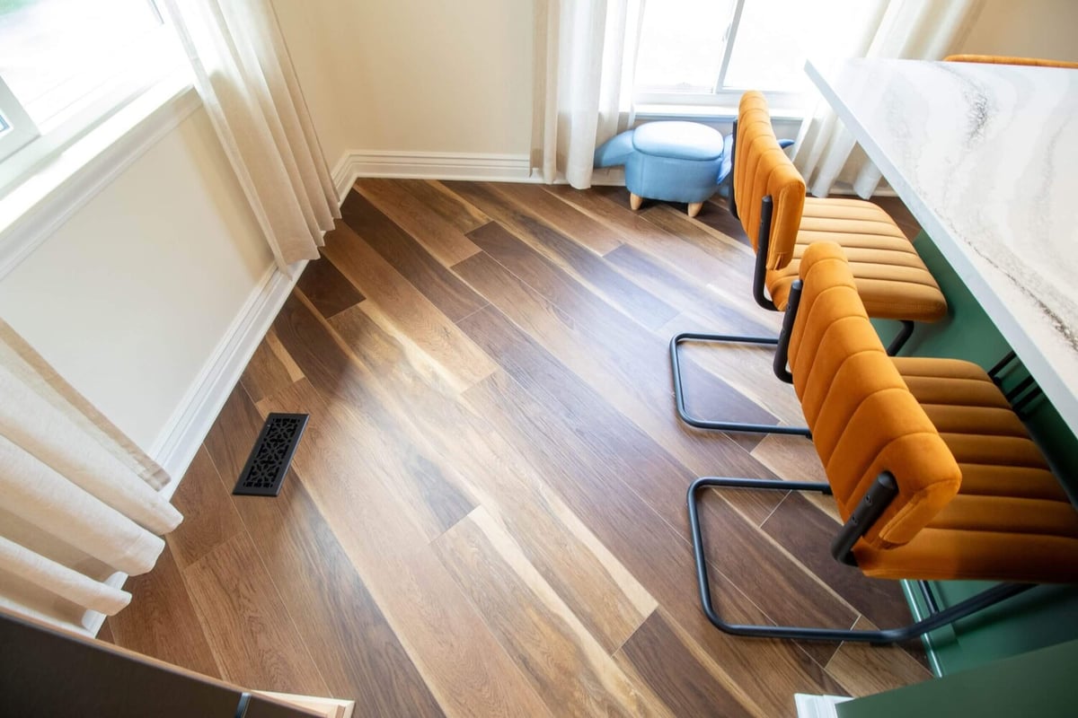 hardwood flooring and island seating in Okemos, MI kitchen remodel by Odd Fellows Contracting