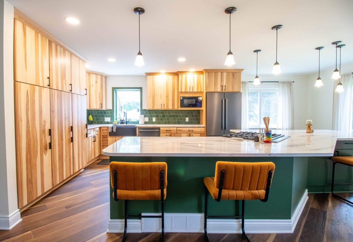 large quartz waterfall island in Okemos, MI kitchen remodel by Odd Fellows Contracting