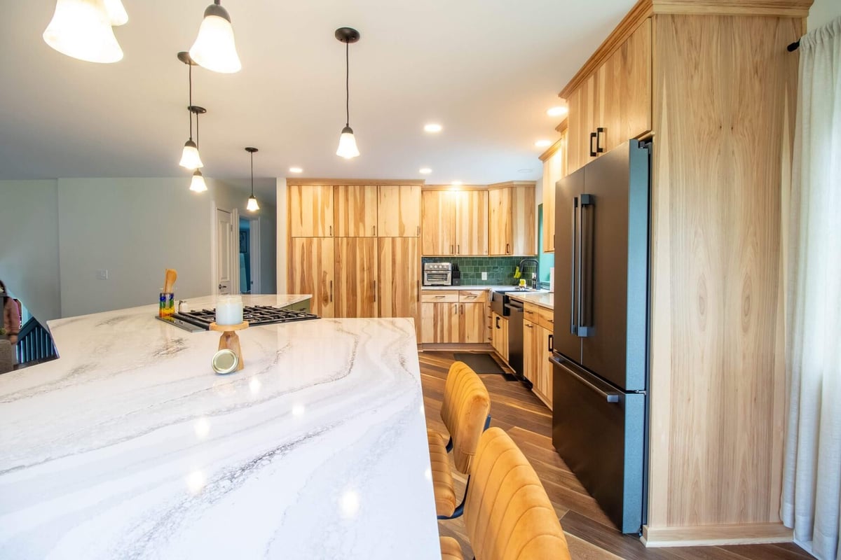 spacious kitchen design with quartz countertops in Okemos, MI by Odd Fellows Contracting