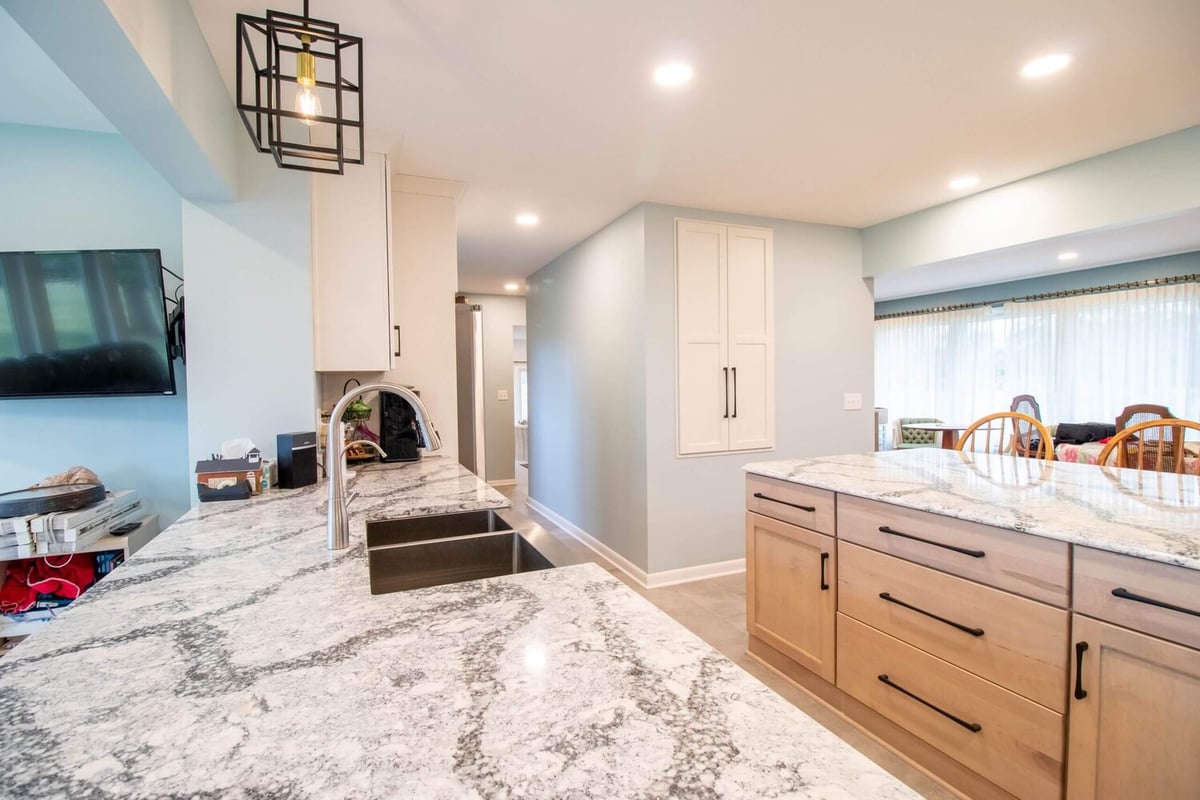 Owosso, MI kitchen renovation by Odd Fellows Contracting highlighting open layout and modern lighting