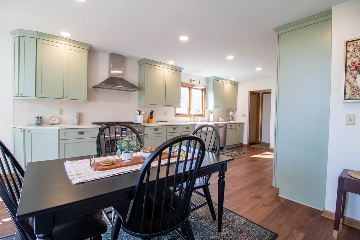 custom kitchen renovation by Odd Fellows Contracting in Holt Four Seasons, MI featuring stainless steel range hood