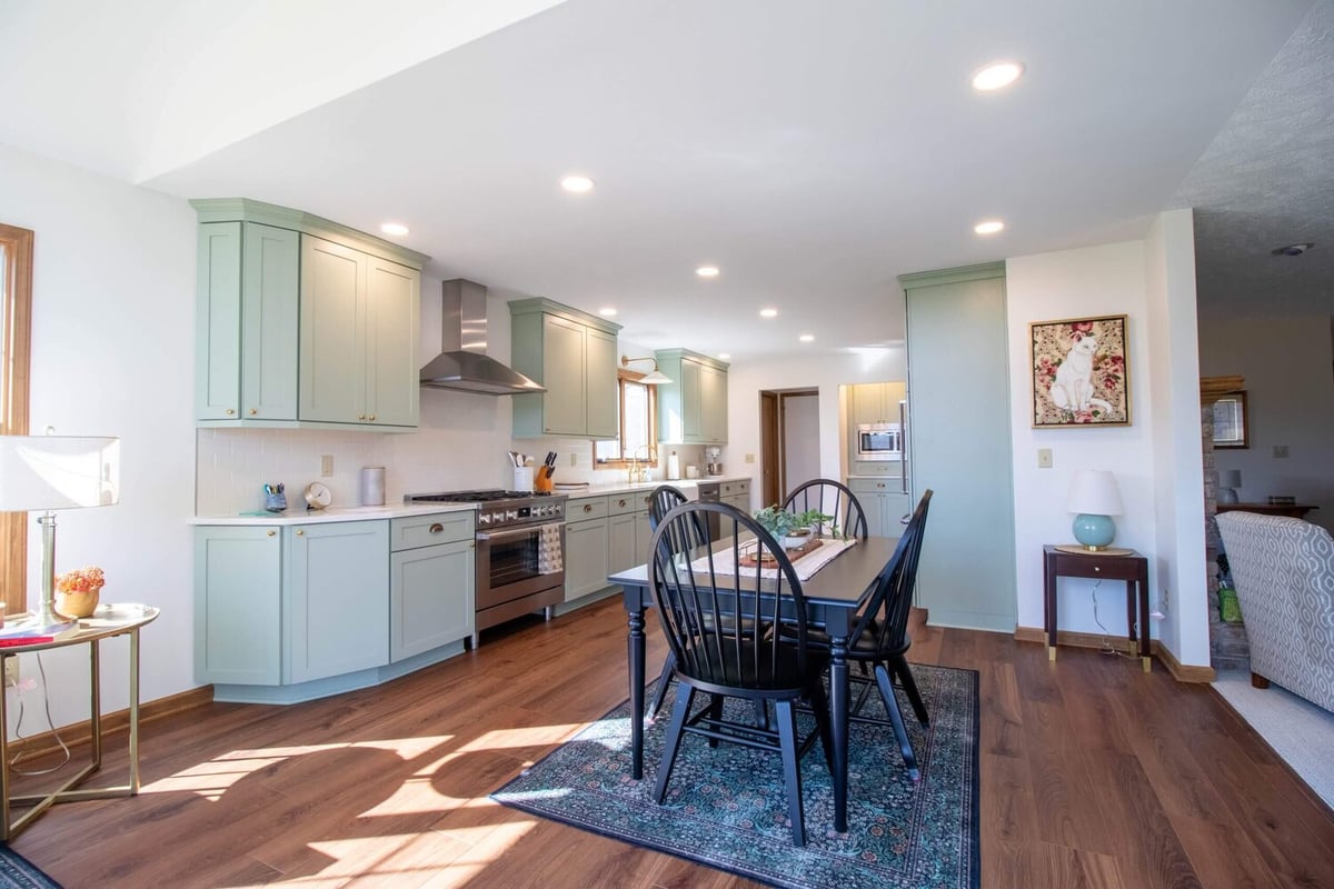 full kitchen view after remodel by Odd Fellows Contracting in Holt Four Seasons, MI with modern lighting