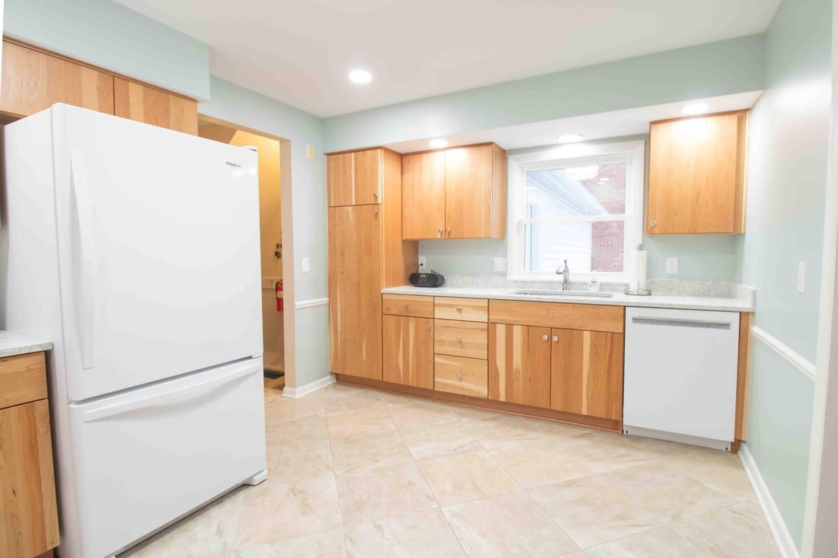 Kitchen remodel with custom wood cabinetry by Odd Fellows Contracting in Lansing, MI