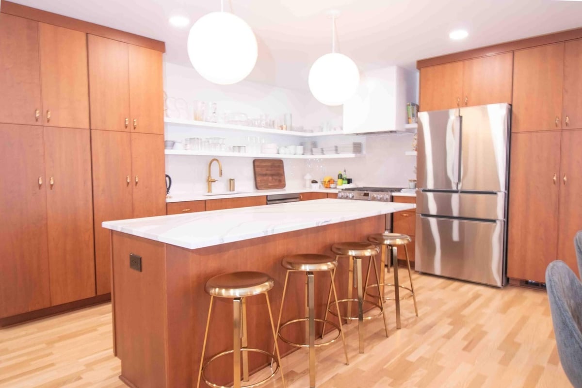 large island kitchen remodel by Odd Fellows Contracting in East Lansing, MI with custom wood cabinetry