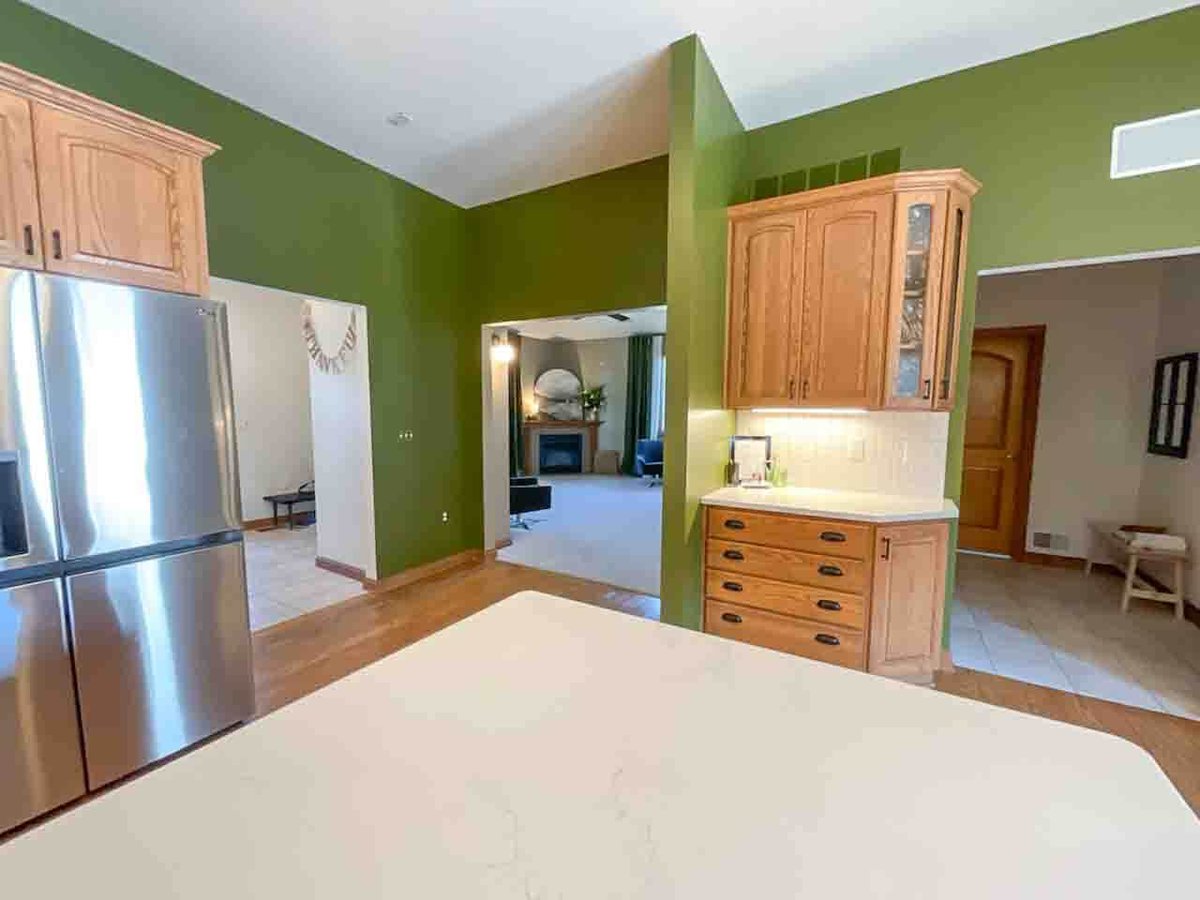 renovated kitchen featuring quartz countertops and modern fixtures by Odd Fellows Contracting in Dewitt MI