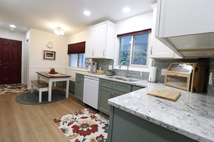 Kitchen remodel in Tacoma Hills, Okemos MI by Odd Fellows Contracting with quartz countertops and subway tile backsplash