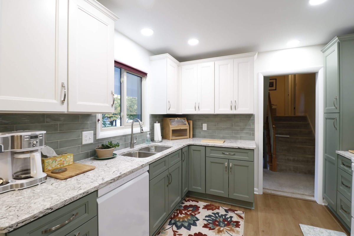 remodeled kitchen by Odd Fellows Contracting in Tacoma Hills, MI with custom cabinets and new appliances