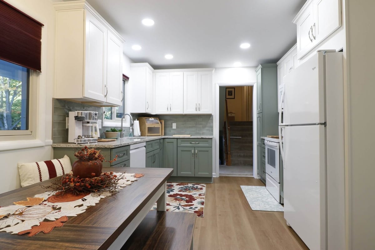 updated kitchen by Odd Fellows Contracting in Tacoma Hills, MI with modern cabinetry and open layout
