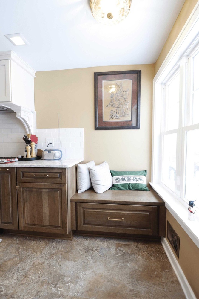Custom kitchen storage and bench seating by Odd Fellows Contracting in Lansing Westside MI