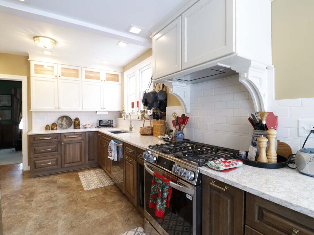 Lansing Westside MI kitchen remodel by Odd Fellows Contracting featuring white shaker cabinets and quartz countertops